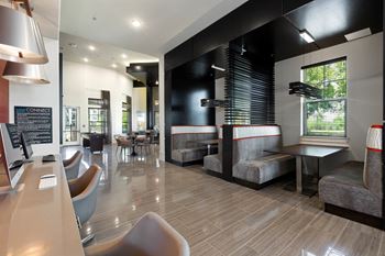 A seating area with tables and chairs at a restaurant